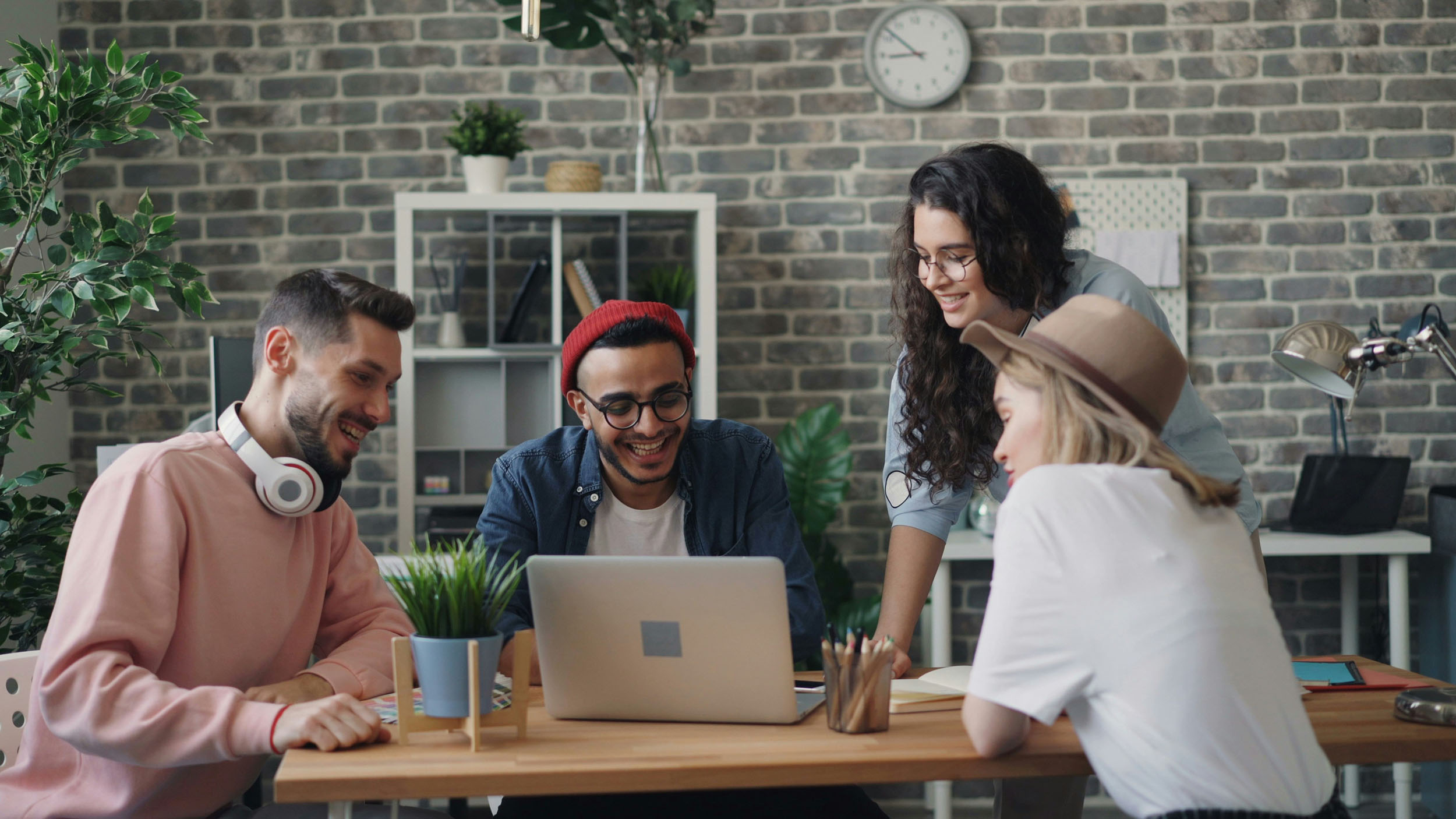 young guys at desktop smiling